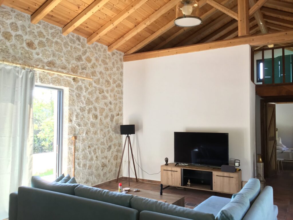 The villa boasts three meticulously designed rooms, furnished with comfortable double beds to cradle you into peaceful slumber as the gentle sea breeze whispers through the stone walls.